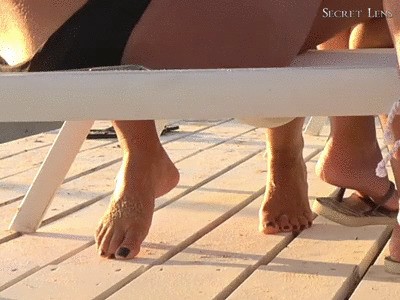 Nude Feet And Black Toenails On The Beach